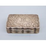 An Edward VII hallmarked silver snuff box with shaped edge and gilt interior,