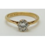 An 18ct gold ring set with a diamond of approximately 0.