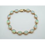 A 9ct gold bracelet set with oval opals