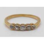 An 18ct gold ring set with five diamonds, 2.