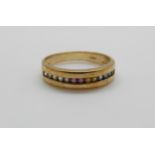 A 9ct gold ring set with a line of multicoloured sapphires, 3.