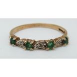 A 9ct gold ring set with emeralds and diamonds (size O)