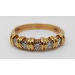 An 18ct gold ring set with diamonds, 5.