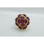A 9ct gold ring set with synthetic rubies in a large cluster, 5.