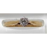 An 18ct gold ring set with an old cut diamond of approximately 0.