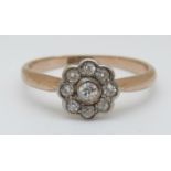 An 18ct gold ring set with diamonds in a daisy cluster, 2.