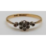 A 9ct gold ring set with diamonds in a flower cluster, 1.