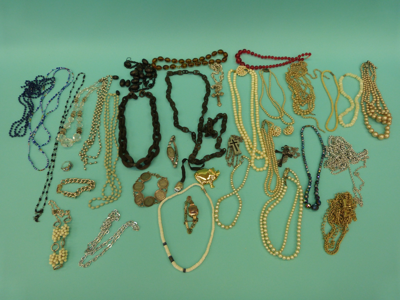 A collection of costume jewellery to include necklaces, crystal, faux pearls, faux amber,