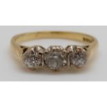 An 18ct gold ring set with three diamonds, total diamond weight approximately 0.