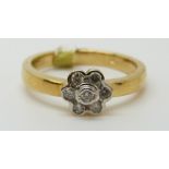 An 18ct gold ring set with diamonds in a cluster, total diamond weight approximately 0.2ct, 5.