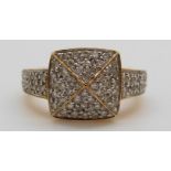 An 18ct gold ring set with diamonds in a large square cluster, total diamond weight approximately 0.