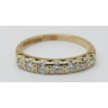 A 9ct gold rings set with seven diamonds, 1.