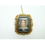 A Victorian mourning brooch set with a portrait miniature of a young woman,