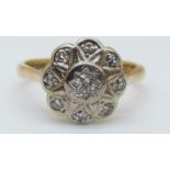 An 18ct gold ring set with diamonds in a cluster, 3.
