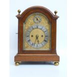 An oak-cased twin fusee mantel clock with movement stamped 558,