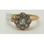 An 18ct gold Victorian ring set with old cut diamonds in a cluster (size M)