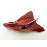 A Norwegian silver brooch set with red enamel in a leaf decoration 5.5 x 3.