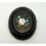 A faceted French jet brooch set with a pietra dura plaque, 4.5 x 3.