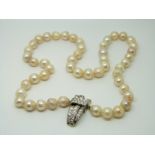 A single strand cultured pearl necklace with 18ct white gold clasp set with diamonds