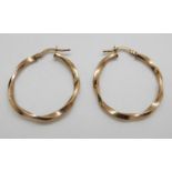 A pair of 9ct gold hoop earrings in twist design, 1.