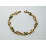 An 18ct gold bracelet made up of cage links with turquoise and pearls