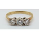 An 18ct gold ring set with three diamonds, total diamond weight approx 0.