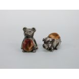 Two white metal novelty pin cushions, one a teddy bear marked sterling silver, height 2.