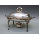 A plated spirit food warmer in the neoclassical style,