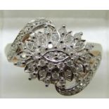 A 9ct gold ring set diamonds in a large cluster, total diamond weight approximately 0.5ct, 3.