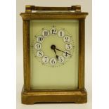 A mid 20thC brass cased carriage clock in corniche style case,