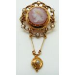 A Victorian gold pendant/ brooch set with a hardstone agate cameo depicting a young woman within a