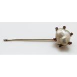 A stick pin set with a baroque pearl approximately 1.5 x 1.