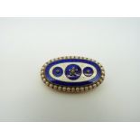 An early Victorian oval brooch,