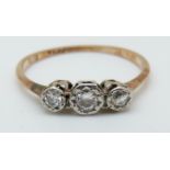 A 9ct gold ring set with three diamonds in a platinum setting (size P)