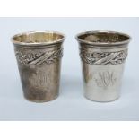 A pair of continental white metal shot beakers, marked to underside 800, height 4cm,