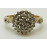 A 9ct gold ring set with diamonds in a cluster, total diamond weight approximately 0.33ct, 2.