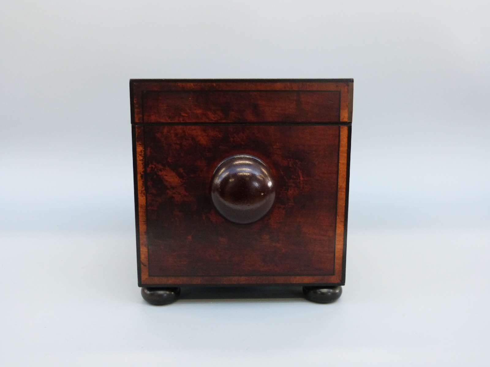 An early 19thC mahogany tea caddy of rectangular form with inlaid ebony detail, raised on bun feet, - Image 8 of 8