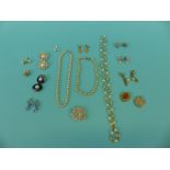A collection of costume jewellery including Trifari earrings, Trifari brooch,