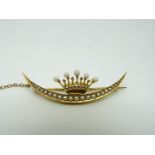 A Victorian 15ct gold brooch set with seed pearls and diamonds in the form of a coronet and