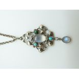 A silver Arts and crafts pendant set with moonstone and turquoise, 4.3 x 2.