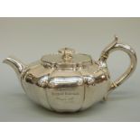 A Victorian hallmarked silver teapot of squat lobed form, London 1844 maker Walter Morisse,