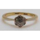 An 18ct gold ring set with diamonds in a platinum setting, 2.
