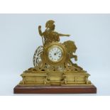 A c1900 brass mantel clock with Roman dial and blued spade hands,