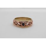 A 9ct gold Clogau ring set with a sapphire in a pierced setting (size O/P)