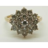 A 9ct gold ring set with cubic zirconia in a large cluster, 2.