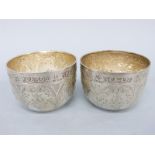 A pair of Victorian hallmarked silver bowls or wine cups with acanthus leaf decoration,