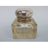 An Edward VII hallmarked silver and cut glass inkwell, Birmingham 1907,