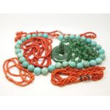 A turquoise necklace, three coral necklaces,