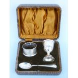 A cased hallmarked silver three piece cruet set