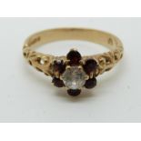 A 9ct gold ring set with garnets and paste